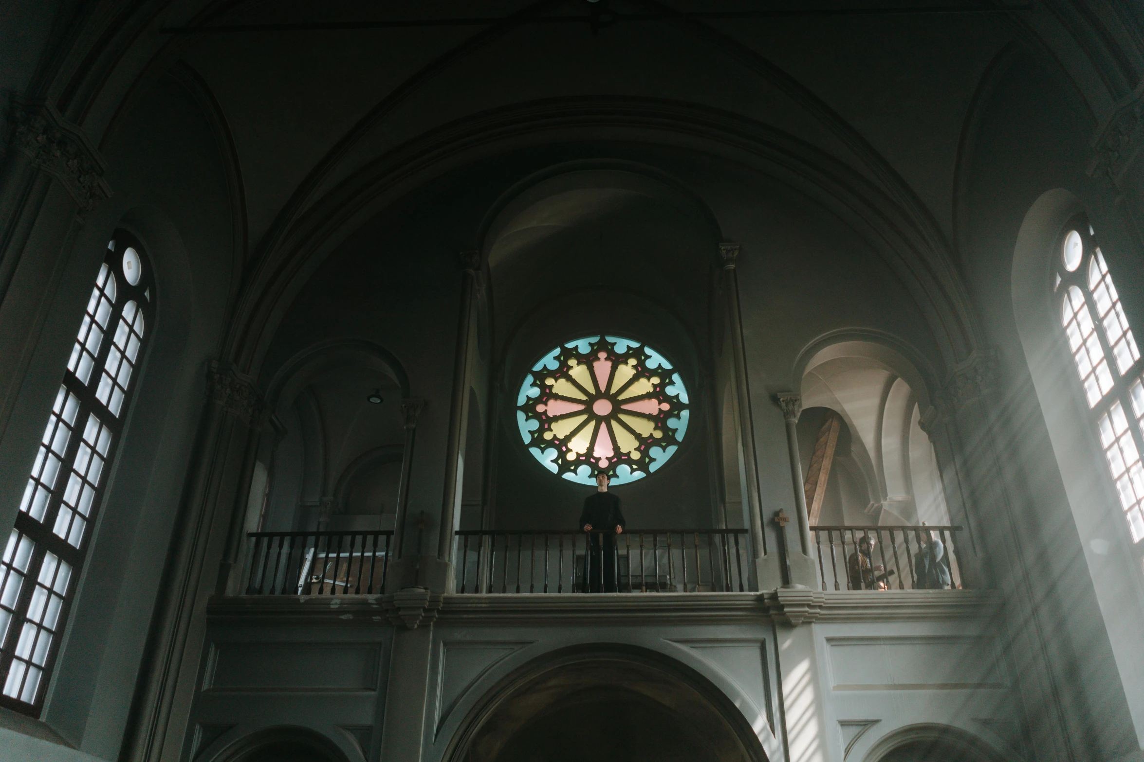 a church that has a big stain glass window in it