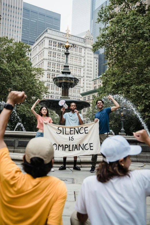 people hold signs and take pos in the city