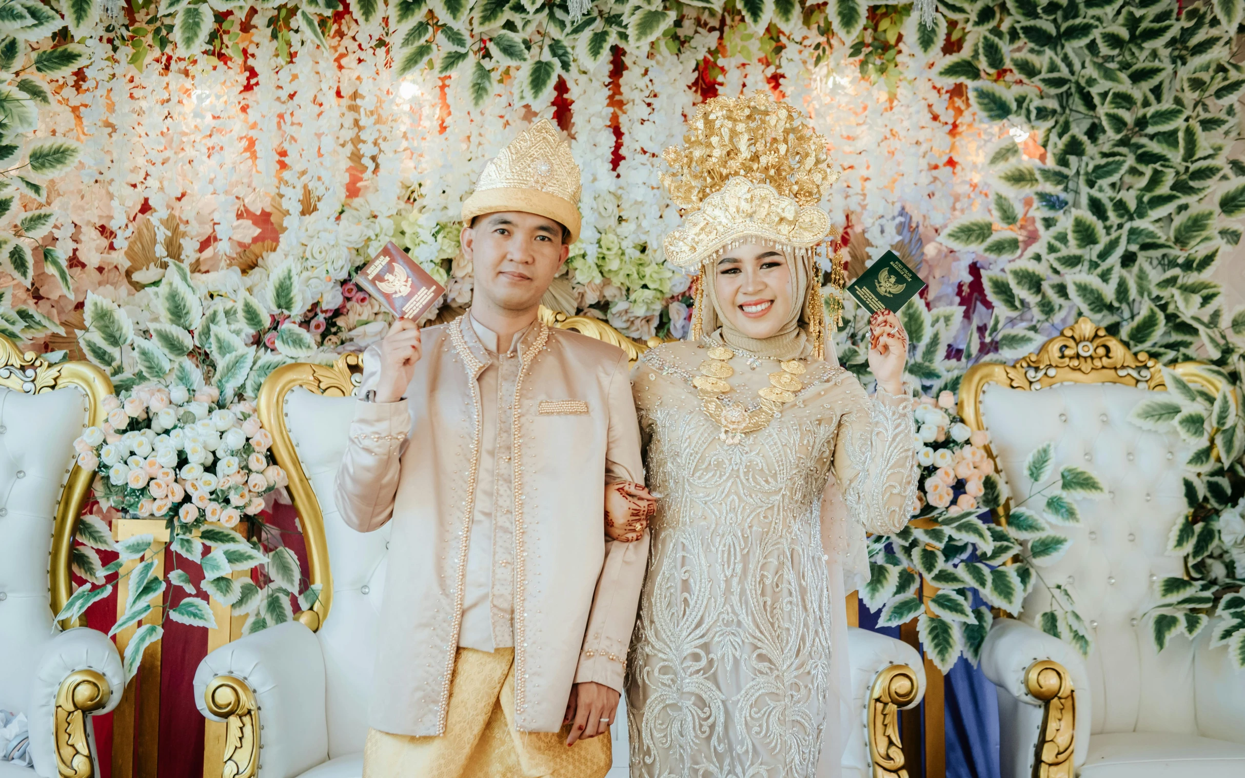 the newly married couple poses for a po with one of them holding a crystal