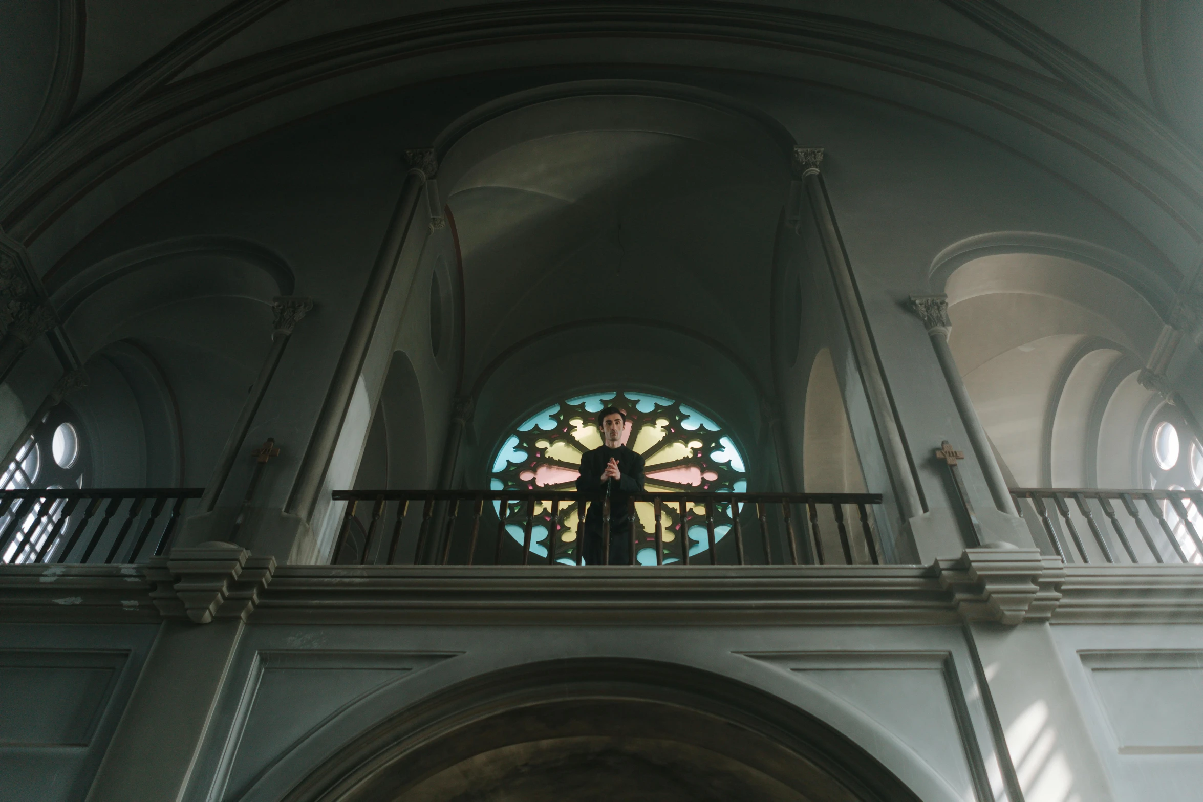 a view of the stained glass window from the upper floor