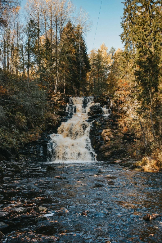 a body of water with rocks on the bottom