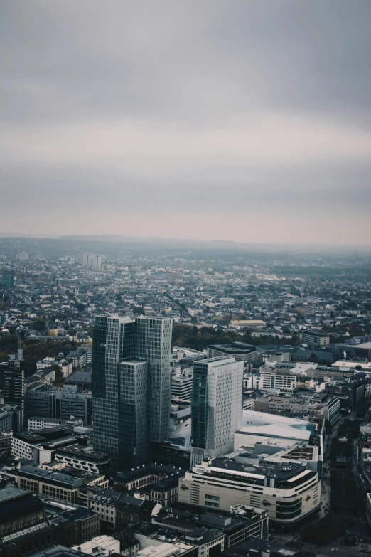 a city is shown as the sky looks cloudy