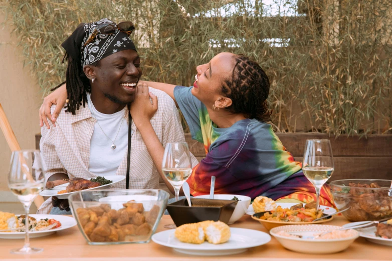 two women sharing a laugh while having dinner