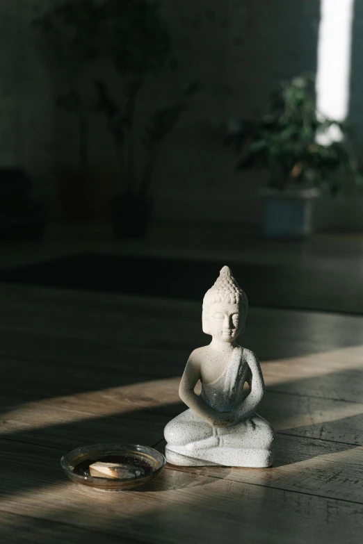 a small statue sitting in the middle of a room