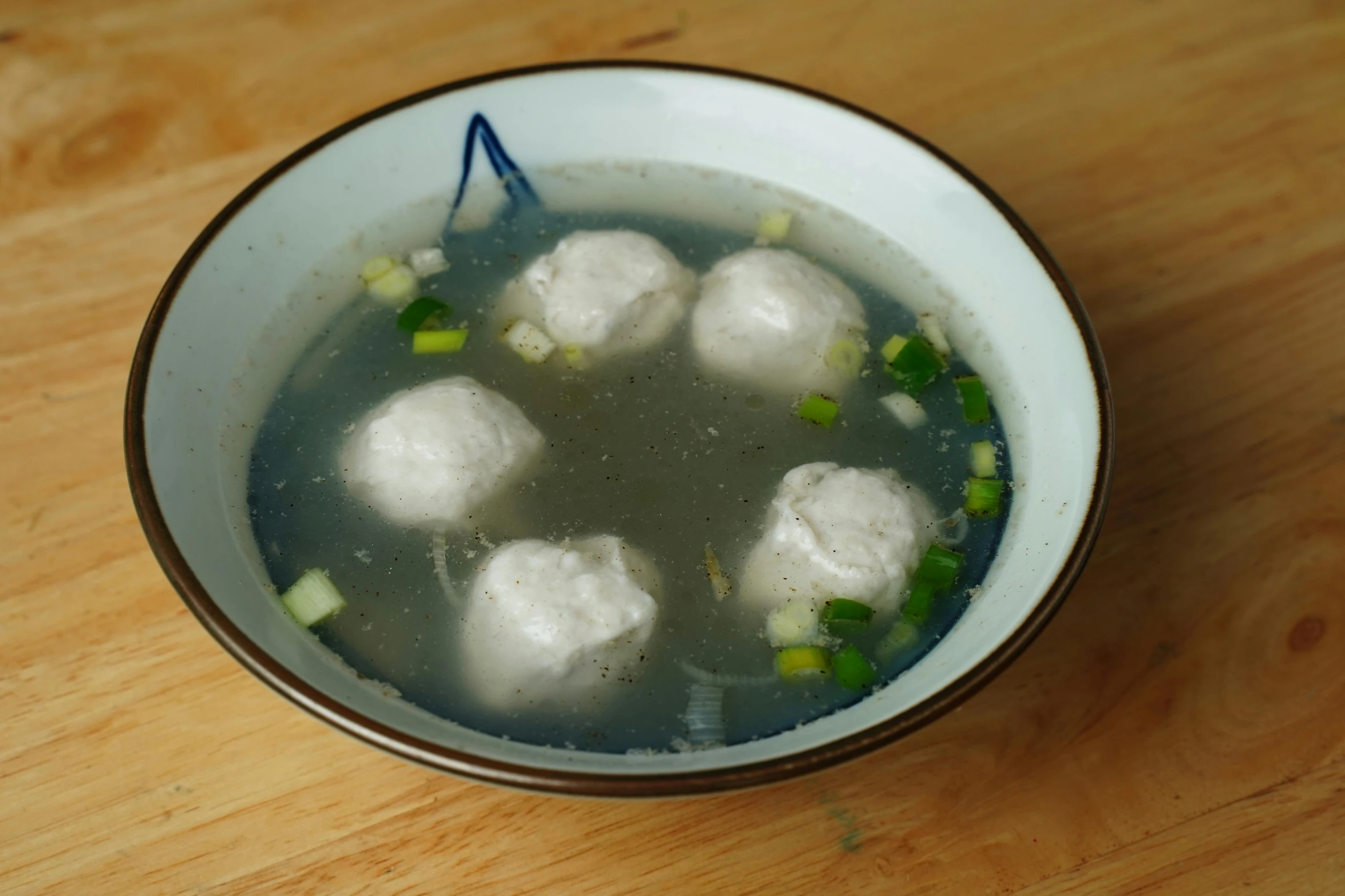 a bowl of food that has meat cubes in it