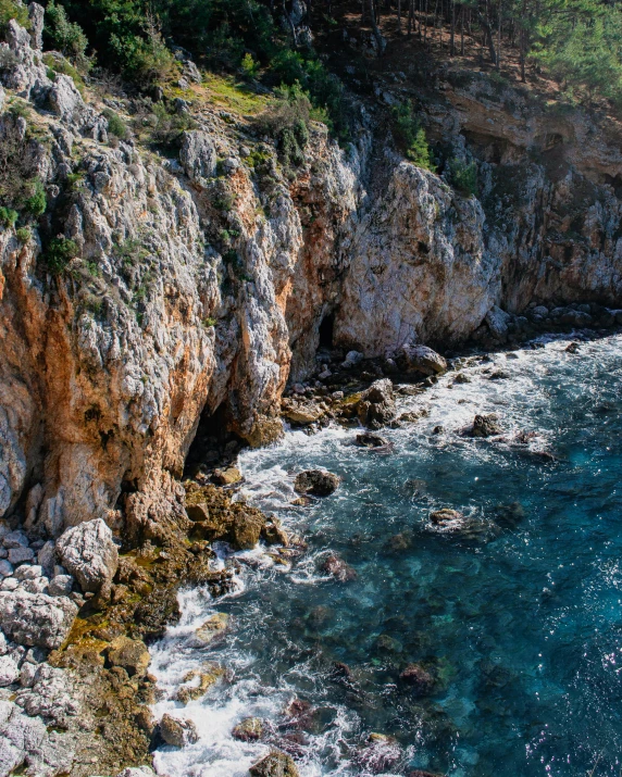 the water is crystal and crystal blue with some rocks