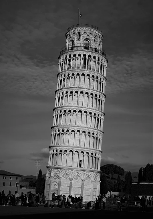 a tall tower with arched arches is in black and white