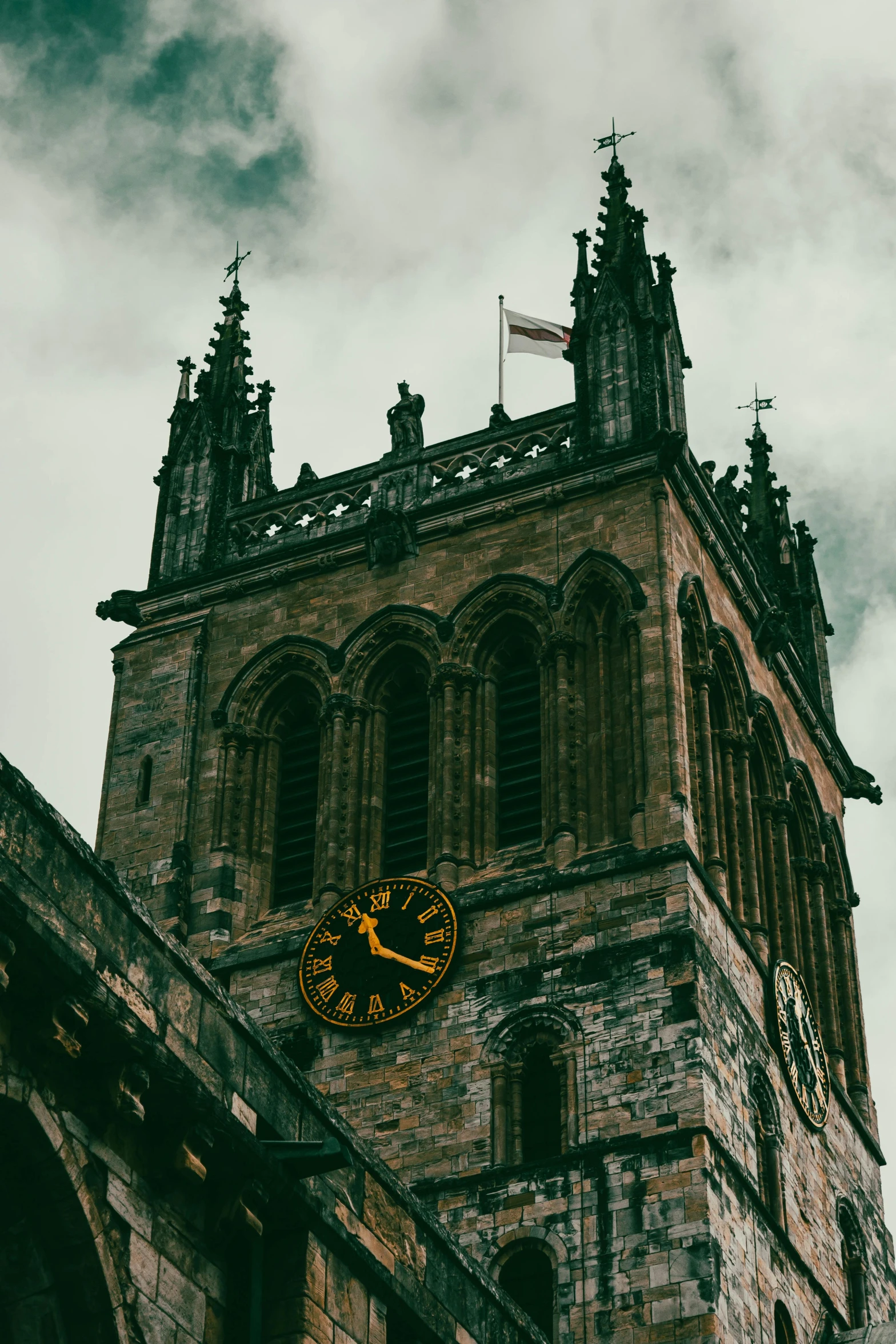 the side of a stone building with a clock