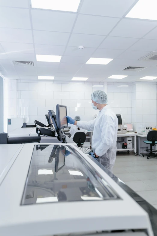 a woman working in an assembly room at a company