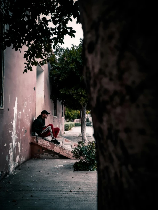 the person is sitting outside on a porch