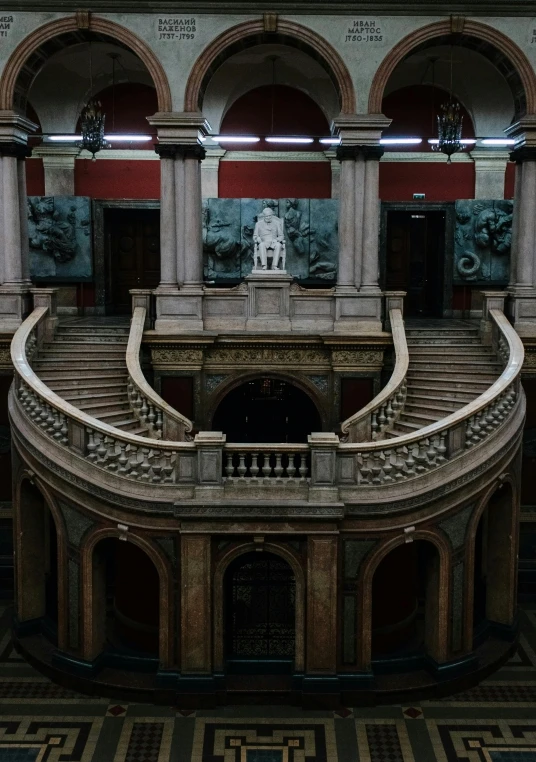 a large stair case in a stone building