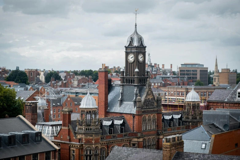 view from a very high point of city of a church and a clock tower