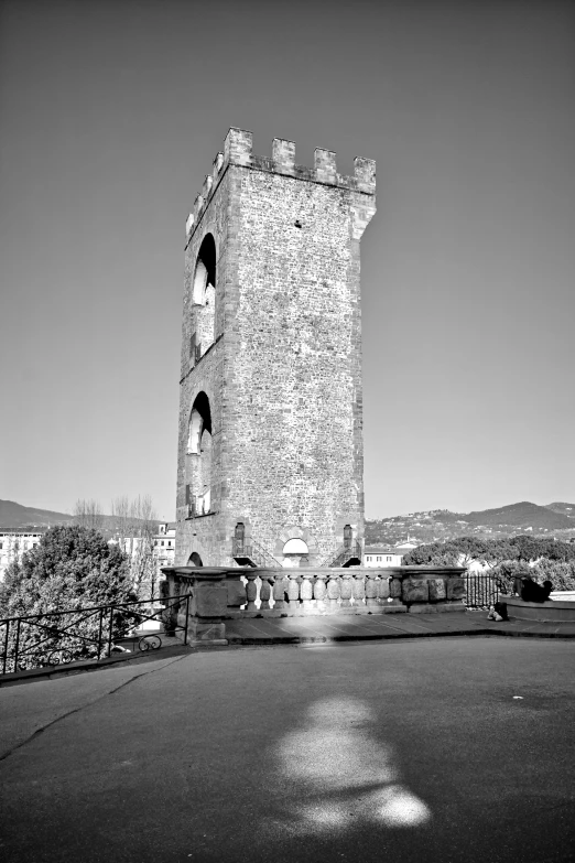 a large tower that is on the side of a road