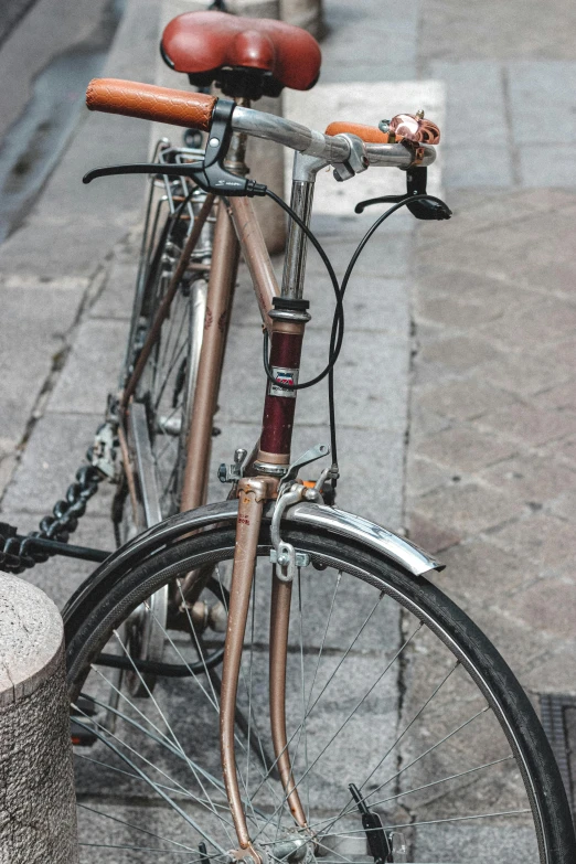 a bicycle parked next to another bike on the street