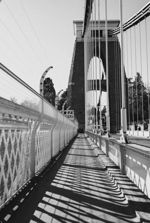 black and white pograph of a street bridge