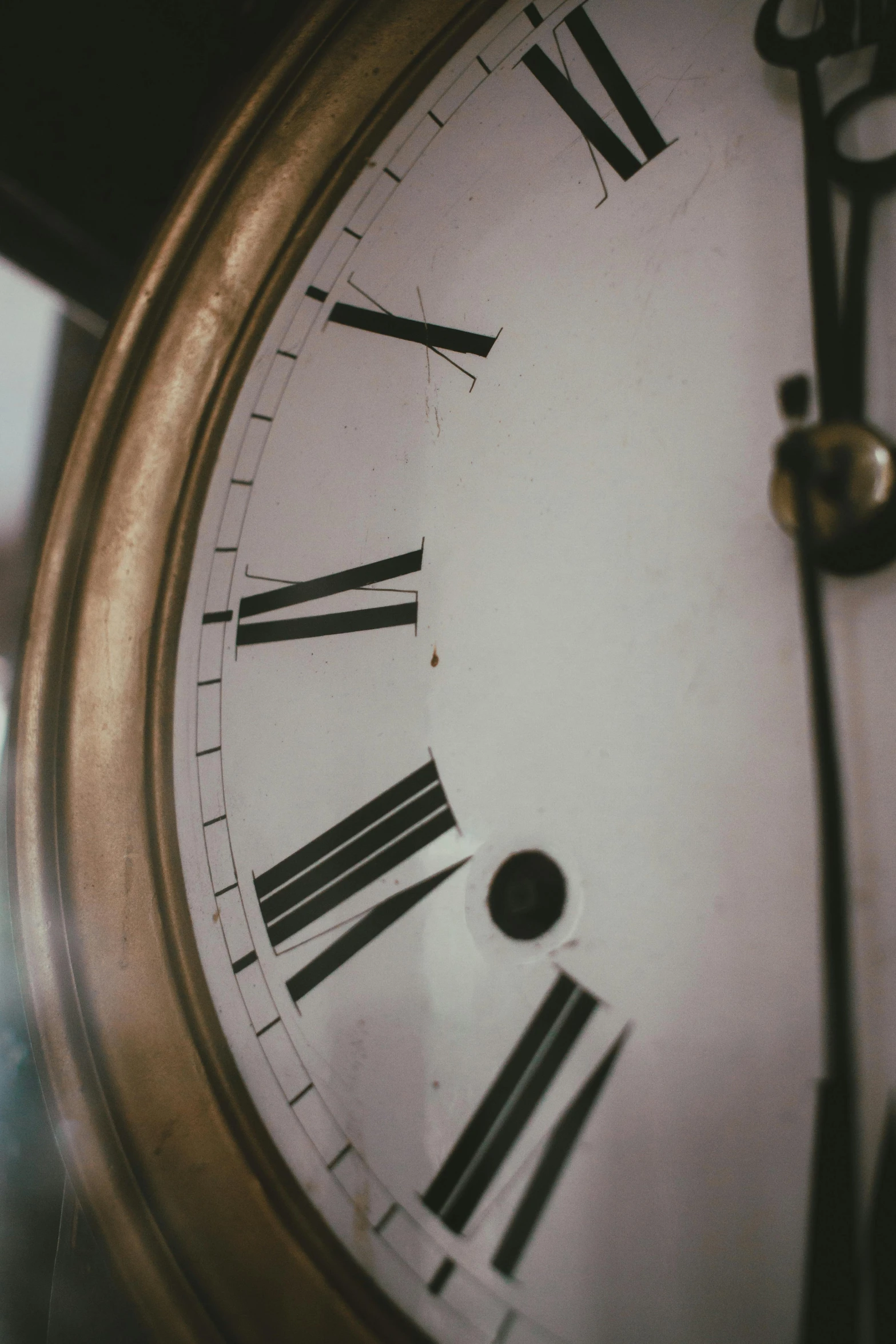 a close up s of an old clock that has roman numerals