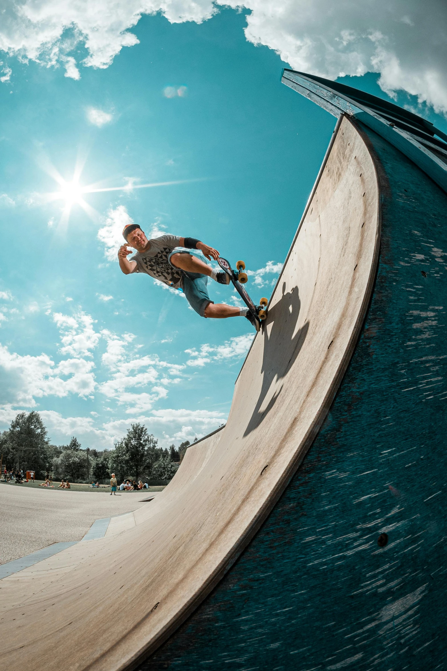 a skateboarder in action on a curved slope