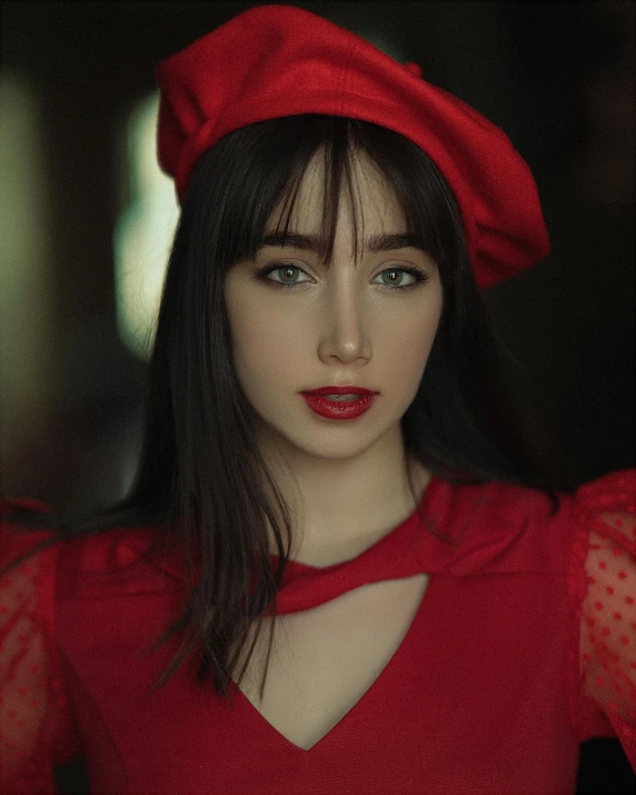 a girl in a red top with a red cap and polka dot shirt