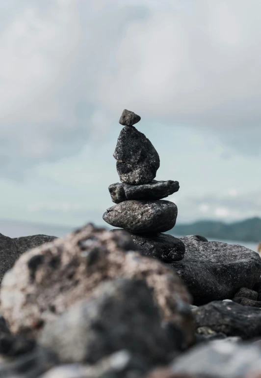 rocks stacked on each other by a river