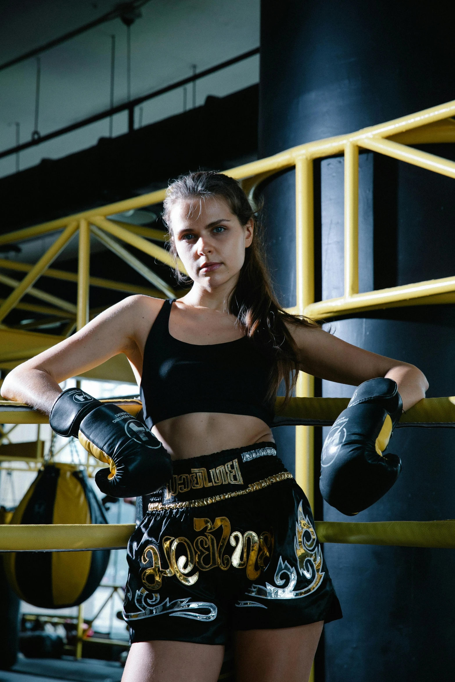 the woman is posing in boxing gear