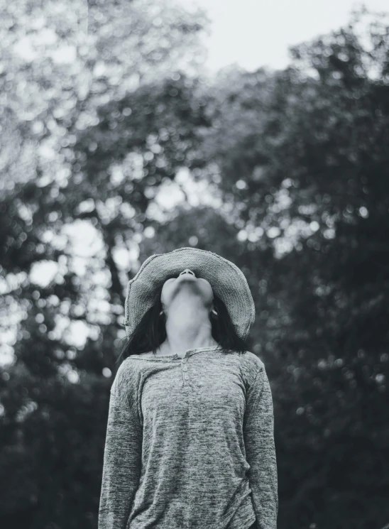 a person wearing a hat that is standing outside