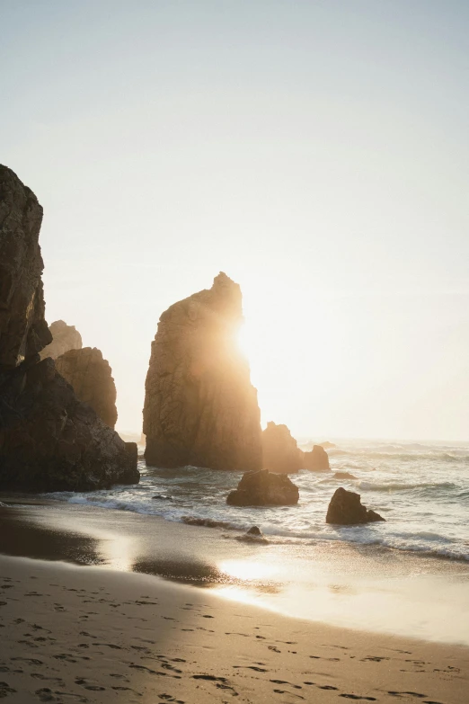 sun shining in the distance over a beach