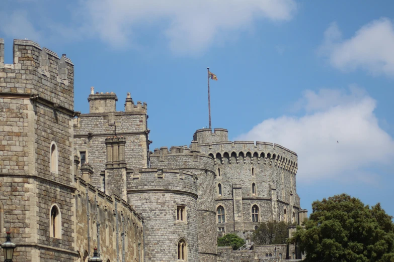 the towers of a castle with a clear blue sky