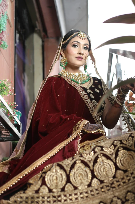 a woman in a red bridal posing for a po