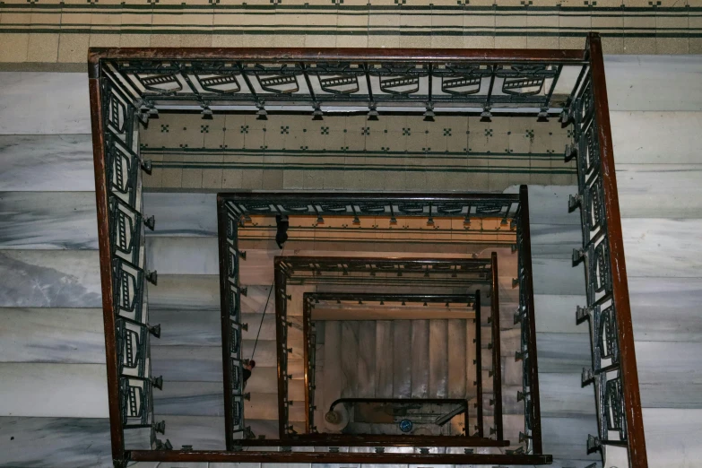 an overhead view of a stair case in the building