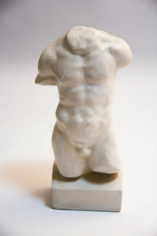 a sculpture of a torso that has  on