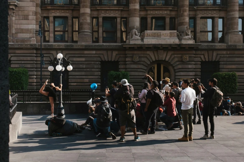 a group of people outside of a building