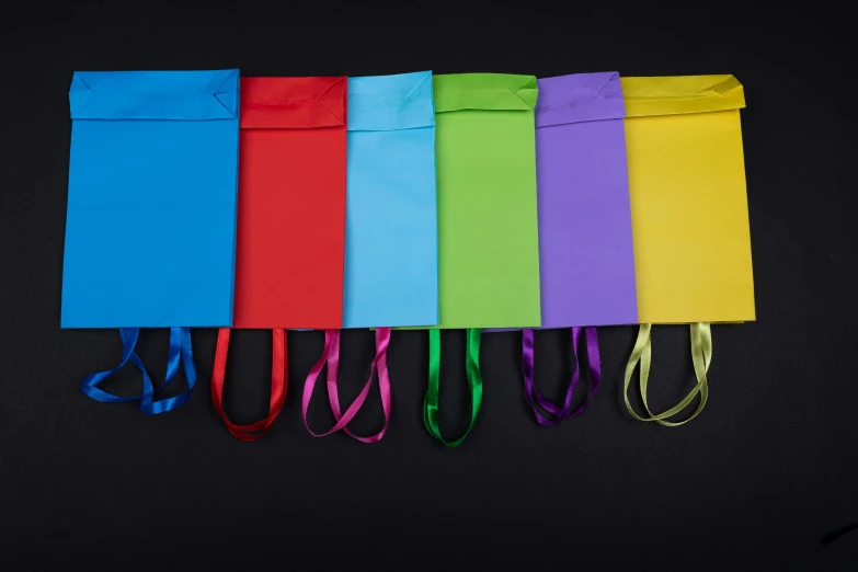 an assortment of small bags with ribbons