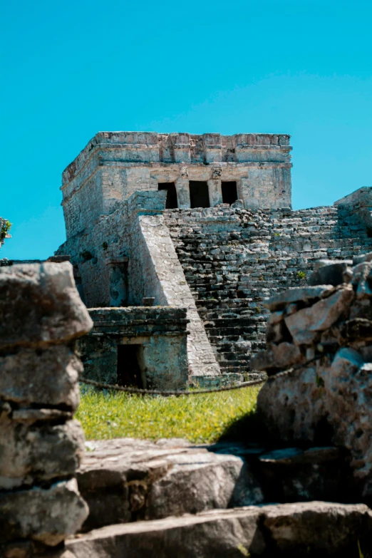 a po looking up at the outside of an ancient stone building