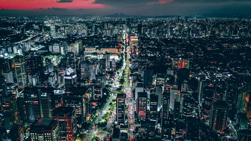 a night view of a city from the top of a tall building