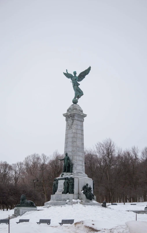 a statue with an eagle and bird on top