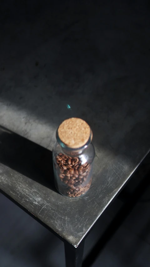 a small can with nuts is on top of a table