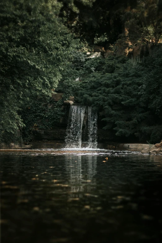 the water has a waterfall coming down it