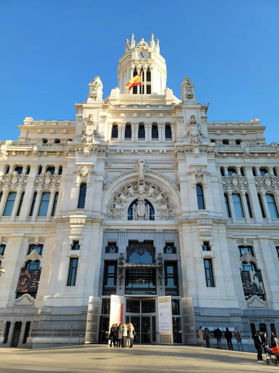 the large building has several windows and arches on top