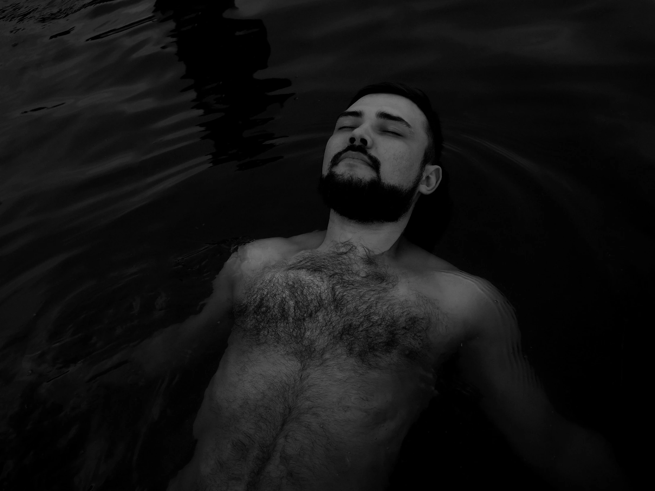 a man who is floating in a body of water