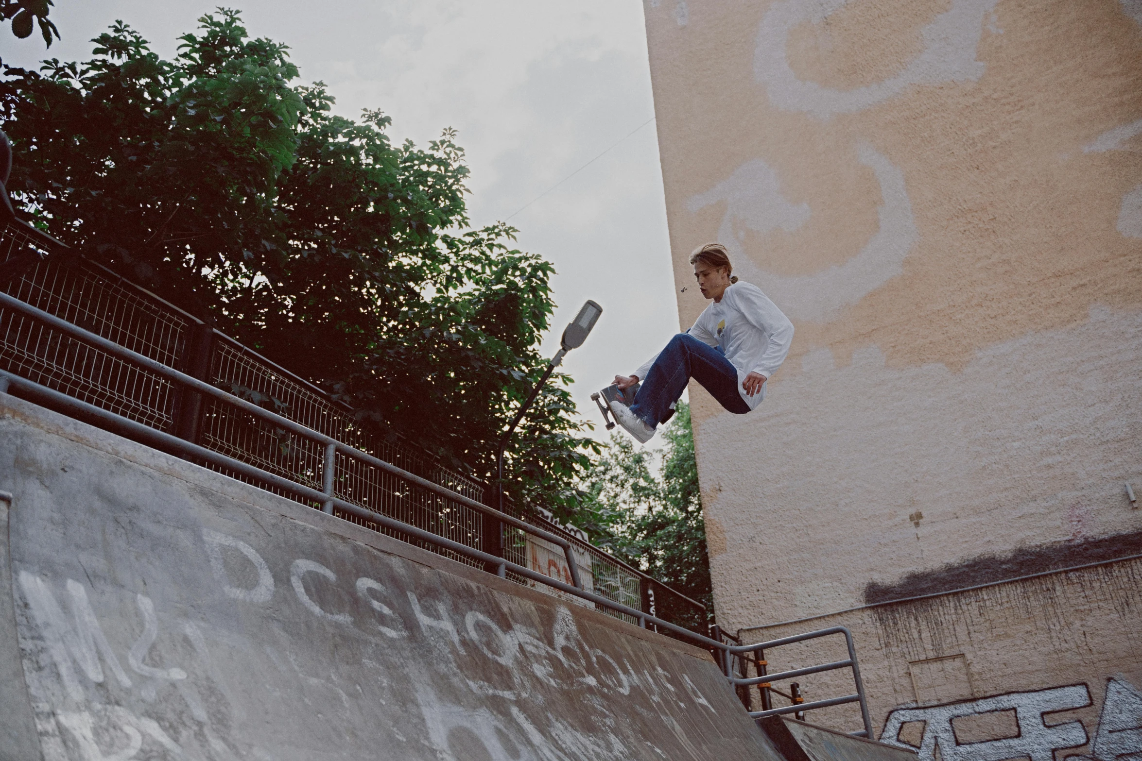 a skateboarder that is doing a trick on the edge