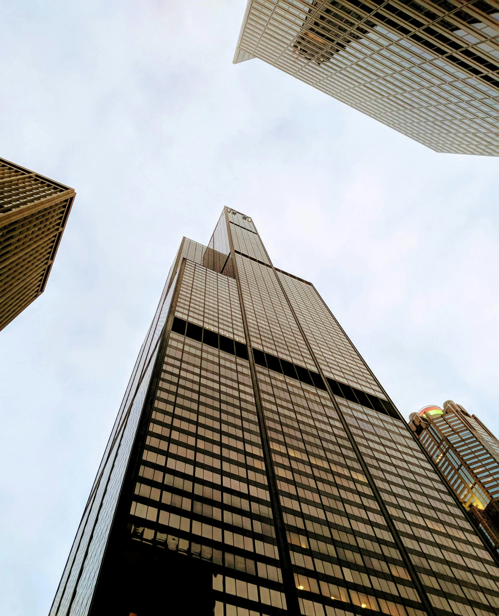 looking up at tall buildings from the ground