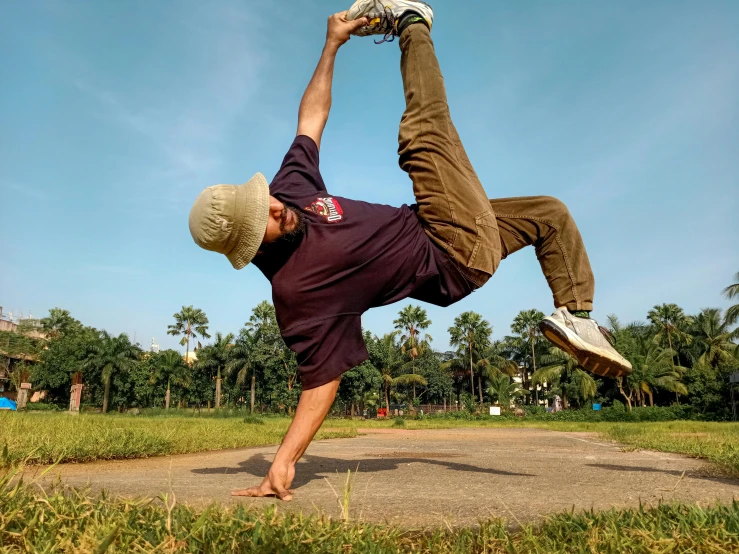 a man doing a trick with his skateboard in the park