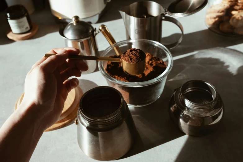 there are some spoons that are in this glass container