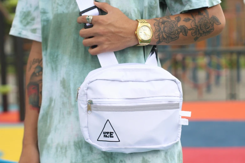 the back pocket of a white bag with a triangle on it