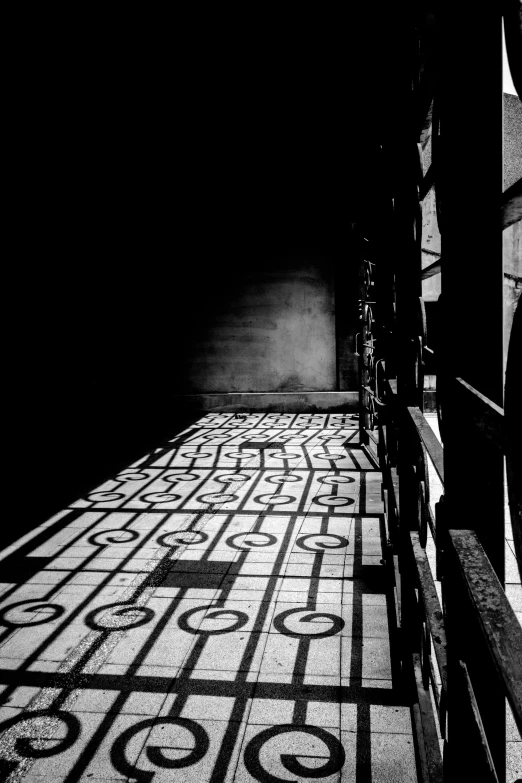 black and white pograph of the tiled floor on a building