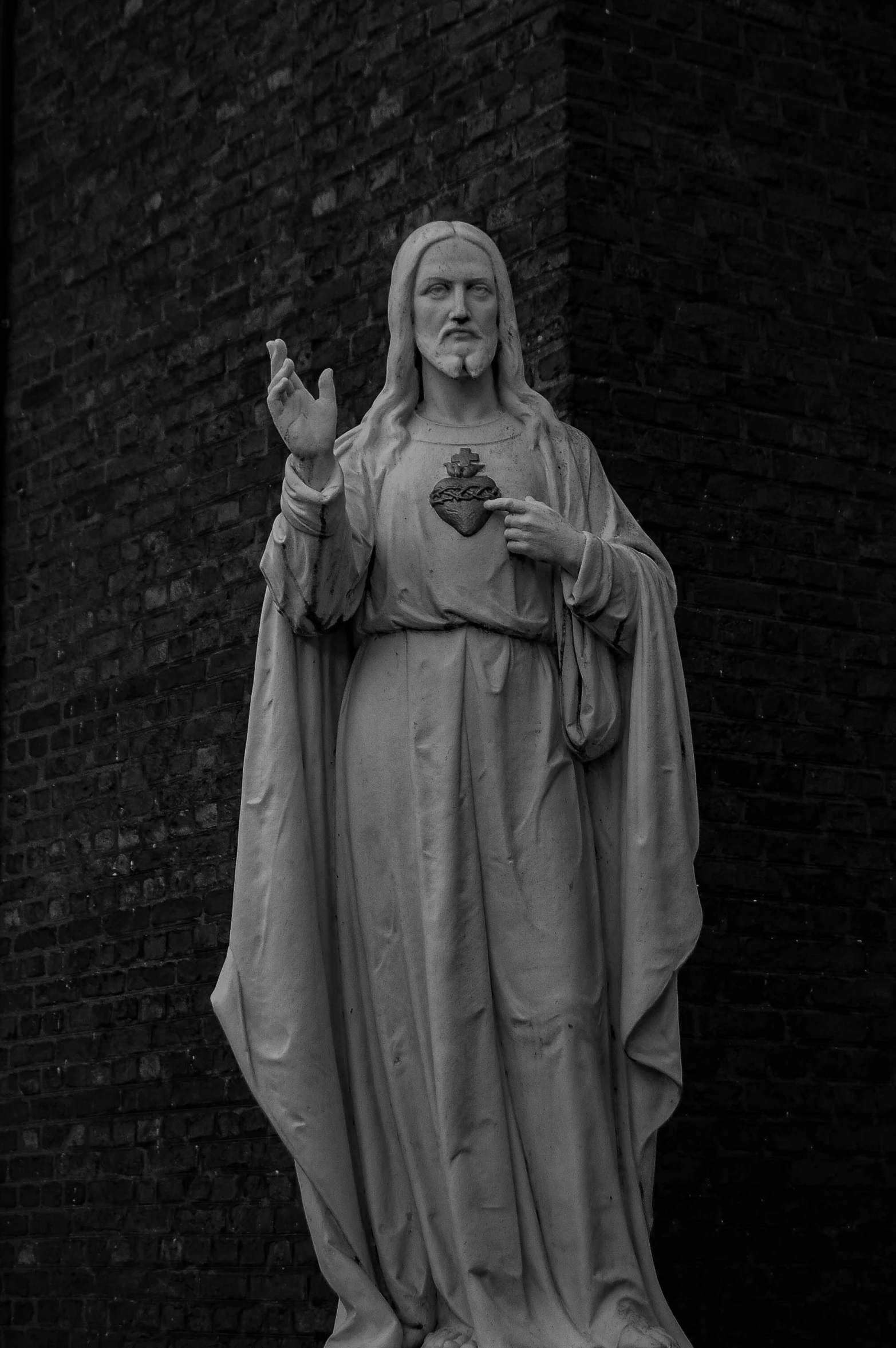 statue of the virgin mary with raised hands