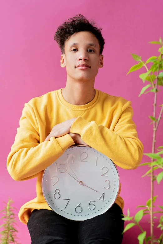 there is a man holding a white clock