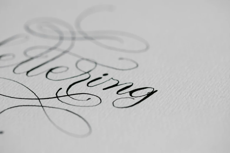 closeup of the lettering on a white paper