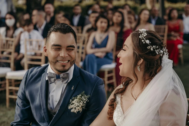 a wedding party at a resort looking at each other