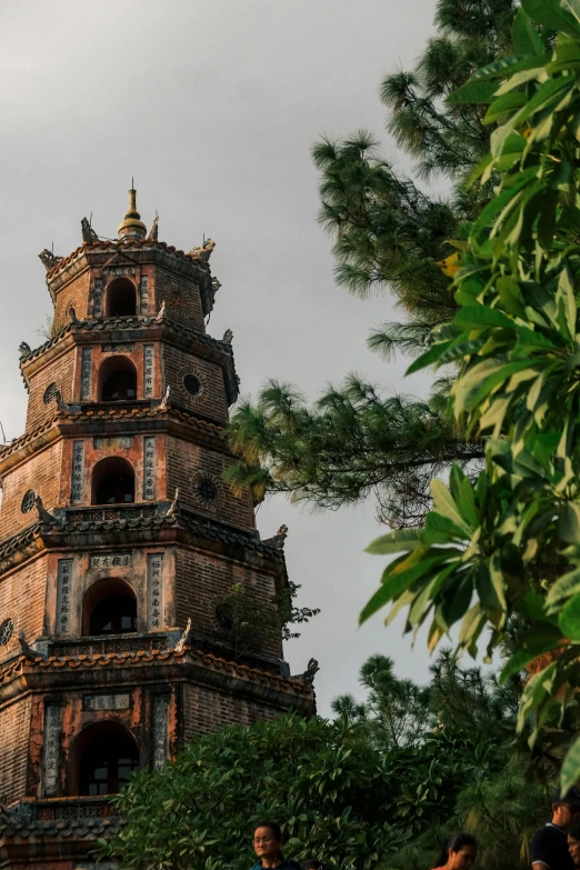 people standing around in front of a tower